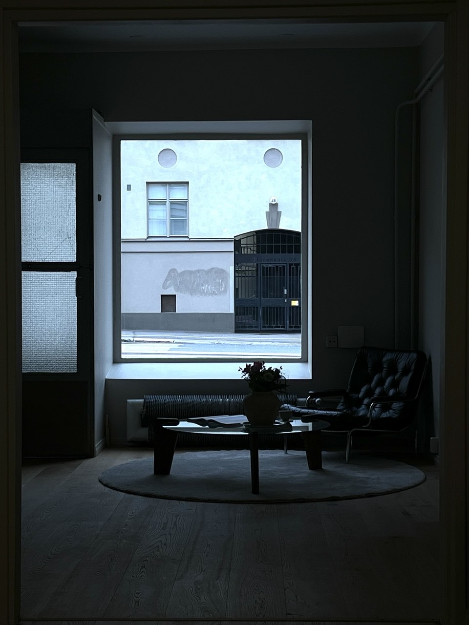 Dim office lounge with a large window